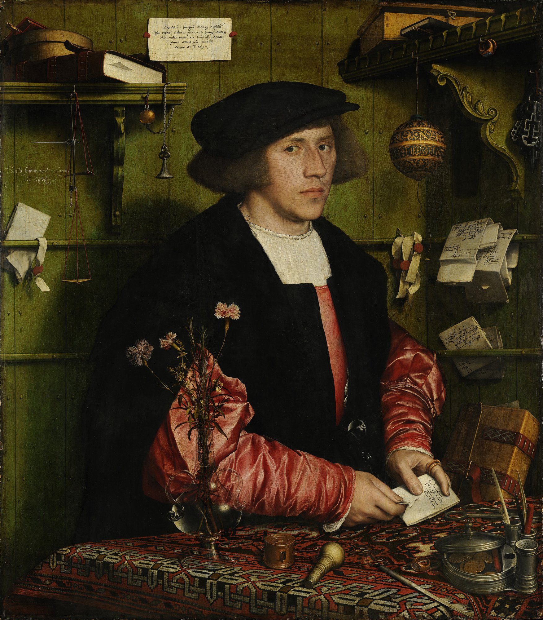 Painted portrait of a young merchant in a black cap seated at a table with letters, scales and a carnation, notes pinned to the panelled wall behind