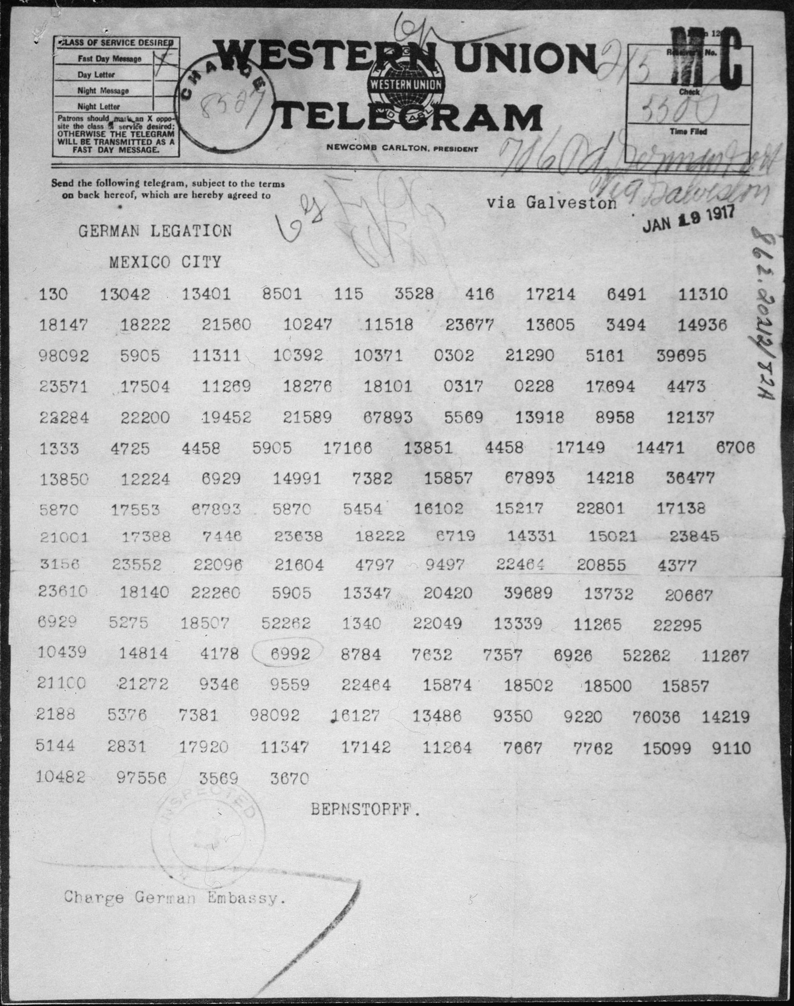 Photograph of a Western Union telegram form covered in five-figure code groups, with a printed date stamp